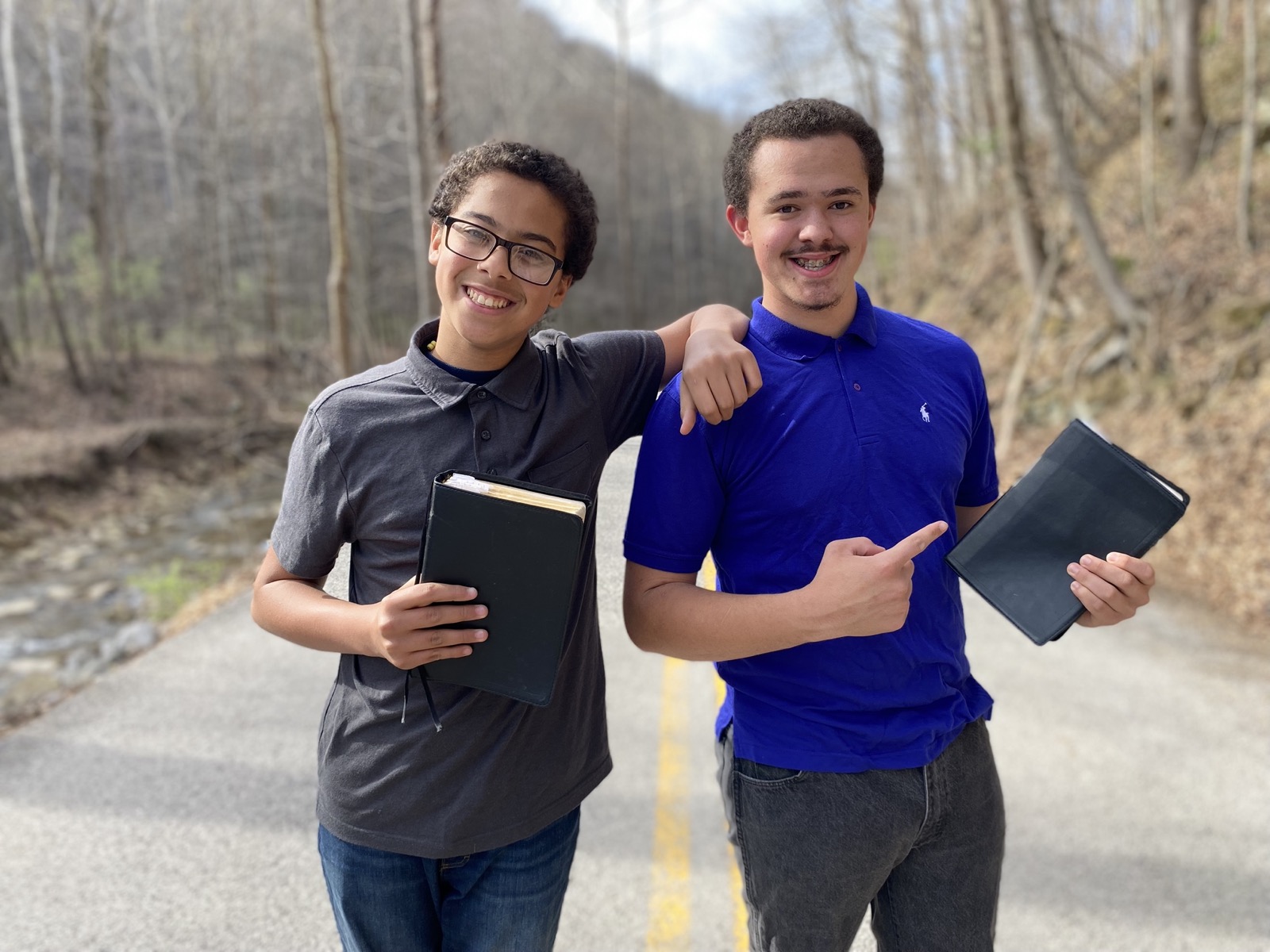 The Bible Memory Bros — two brothers on a road holding their Bibles
